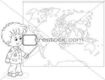 Schoolboy at a World map