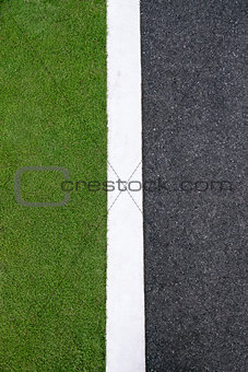 high angle view of asphalt of street and grass 