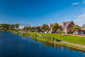 Peaceful quiet suburban with expensive houses on lake in Europe