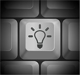Light Bulb Icon on Computer Keyboard