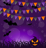 Halloween background with pumpkins and hanging flags