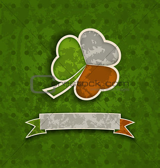 Holiday vintage background with clover and ribbon in Irish flag 