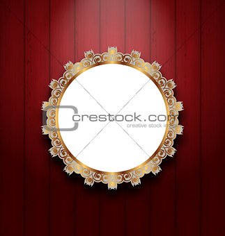 Ornate picture frame on wooden wall 