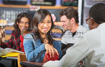 Smiling Young Woman in Cafe