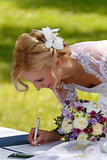 beautiful blonde smiling bride signed contract