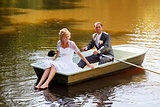 Young just married bride and groom on boat