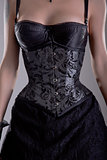Close-up shot of elegant woman in silver corset 