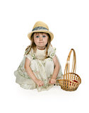 little girl in a straw hat with a basket