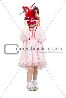 little girl in a red mask in studio