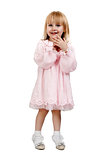 little girl in a pink dress in studio