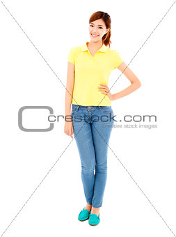 smiling asian young woman standing and hand on waist