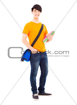 young student holding books and slanting knapsack