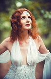Closeup portrait of a beautiful redhead elf woman 