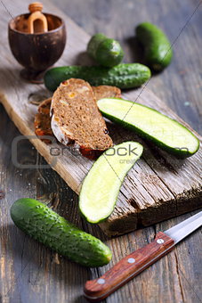 Black bread and fresh cucumbers.