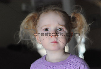 Little girl with a confused facial expression