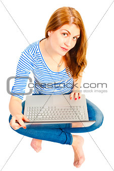a charming young girl on a white background with a laptop