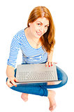 Smiling girl with laptop in the studio