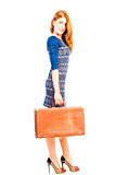 beautiful girl in a dress with an old suitcase