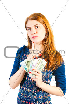 Pensive beautiful girl with money
