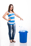 Beautiful young woman recycling