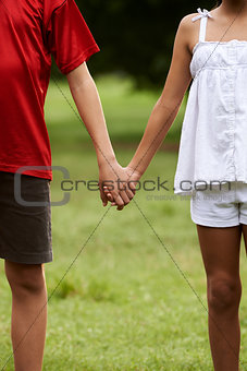 Children in love boy and girl holding hands