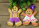 traditional Christmas gingerbread man with festive decorations and Christmas tree