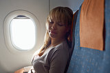 people travelling relaxed woman sleeping on plane