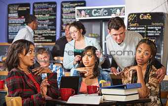 Man Annoying Students in Cafe
