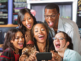 Laughing Students Holding Smartphone