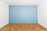 Empty room with a blue wall