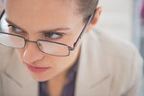 Closeup on business woman wearing eyeglasses