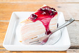 Delicious whipped cream crepe cake with blueberry sauce 