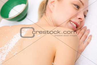 Close-up of woman with salt crystals back