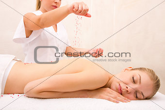 Woman lying spa table receiving therapy