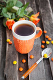 Cup of tea and colorful candies