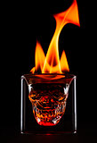 Skull shape glass with flames on the top