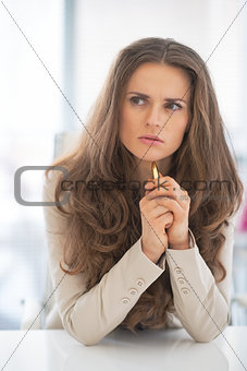 Portrait of thoughtful business woman in office looking on copy 