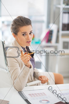 Business woman in office explaining something