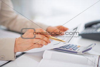 Closeup on business woman working with documents