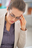 Portrait of frustrated business woman with eyeglasses in office