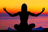 Yoga woman over sunset