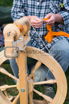 woman working with spinning wheel