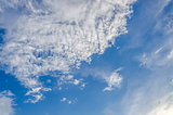 Puffy clouds and blue sky in sunny day