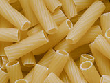 uncooked maccheroni pasta tubes food texture background