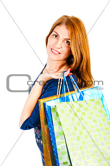portrait of a beautiful girl in the studio with packages of diff