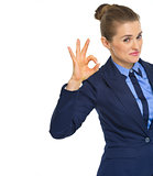 Smiling business woman showing ok gesture