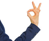 Closeup on business woman showing ok gesture