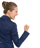 Happy business woman showing fist pump gesture