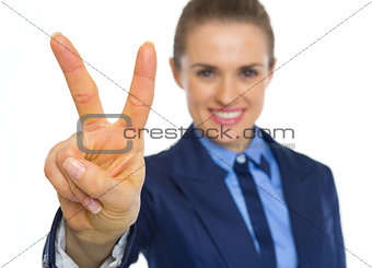 Closeup on business woman showing victory gesture