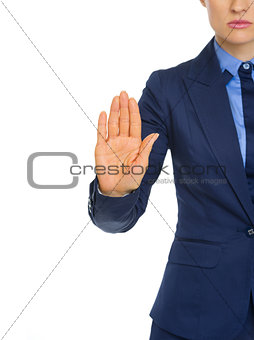 Closeup on business woman showing stop gesture